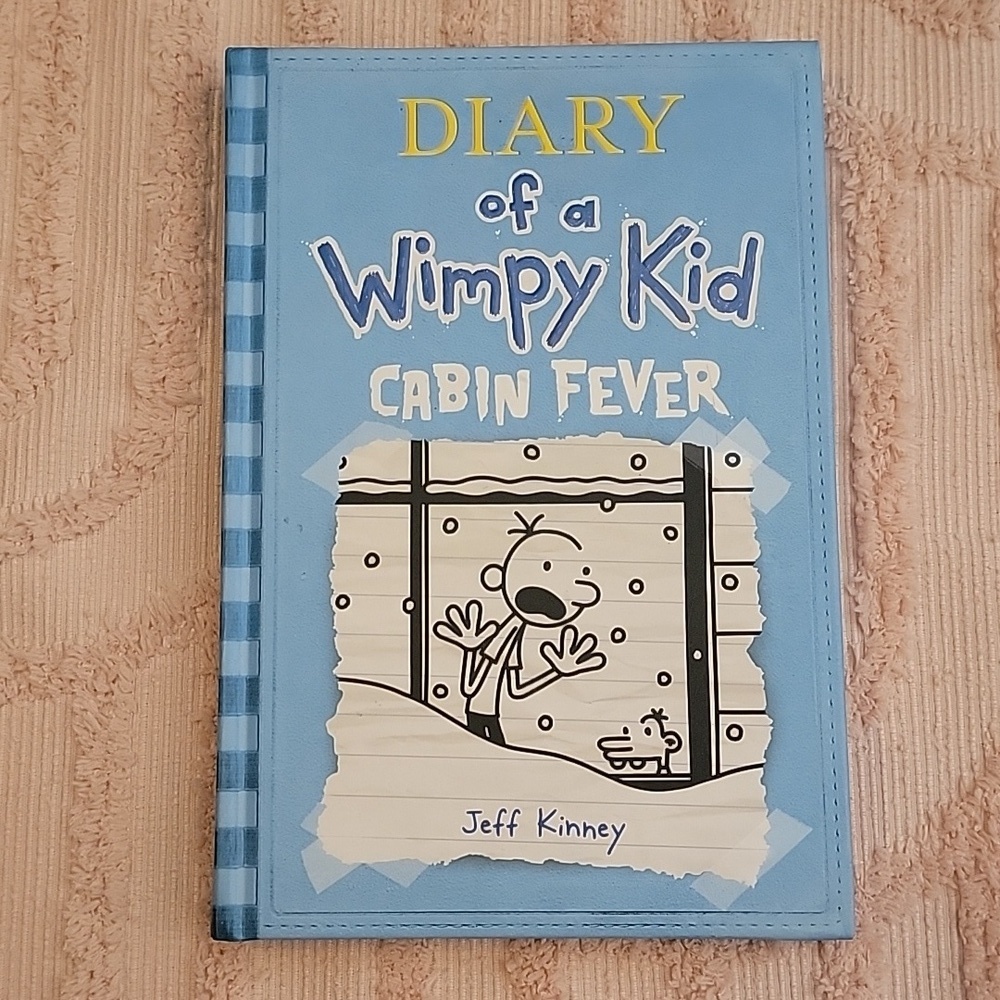 Diary of a Wimpy Kid Cabin Fever, Hardback book, 217 pages.